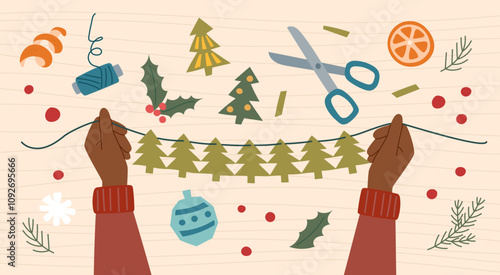 Sustainable Christmas concept. Eco friendly handmade decoration. Hands make ecological Christmas garland from paper.