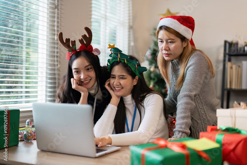 Festive Christmas Celebration with Friends Enjoying Holiday Spirit and Gift Exchange in Cozy Home Setting photo