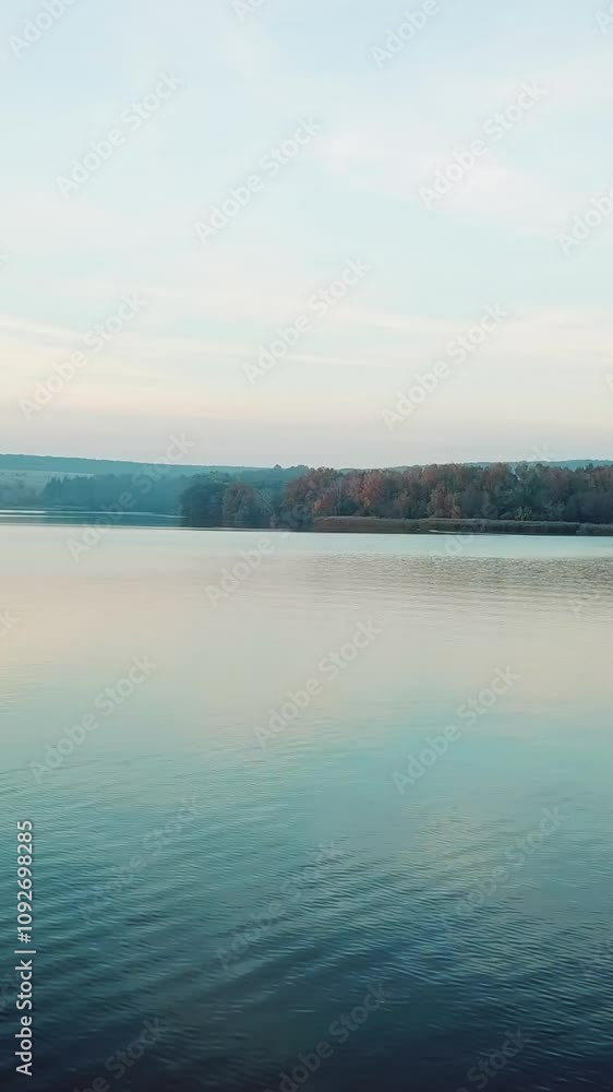 wonderful landscape of a river with a smooth surface and its bank with forests. Weekend in a picturesque place. Camera motion to left. wonderful landscape of a river with a smooth surface and its bank with forests. Weekend in a picturesque place. Camera motion to left.