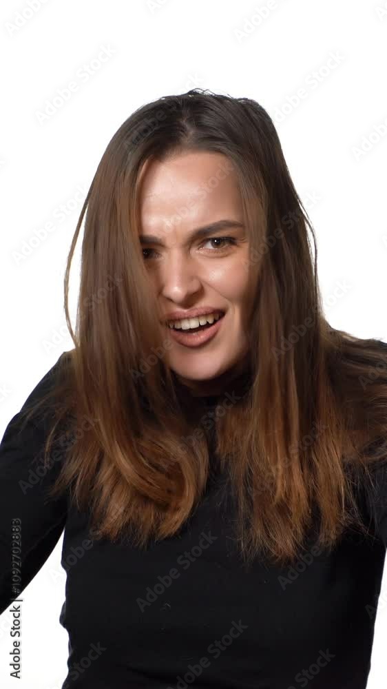 Positive human emotions. Pretty young woman with shopping bags after successful shopping, smiling and looking at the camera on a white background Positive human emotions. Pretty young woman with shopping bags after successful shopping, smiling and looking at the camera on a white background