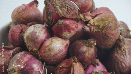 A Bowl of Unpeeled Red Onions