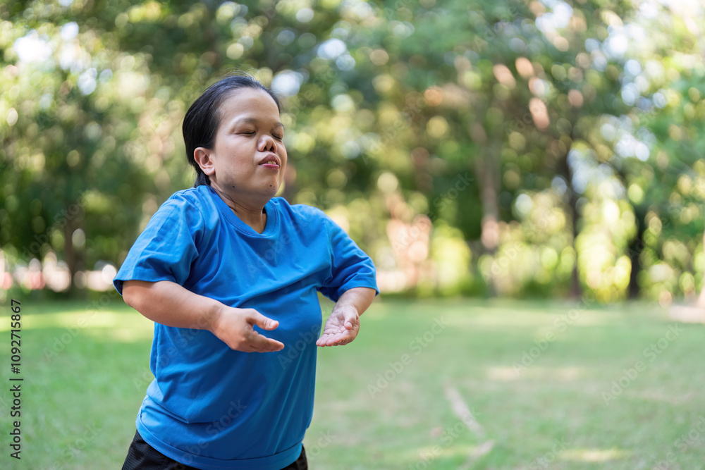 Woman in Blue Shirt Enjoying Outdoor Exercise in a Lush Green Park on a Sunny Day