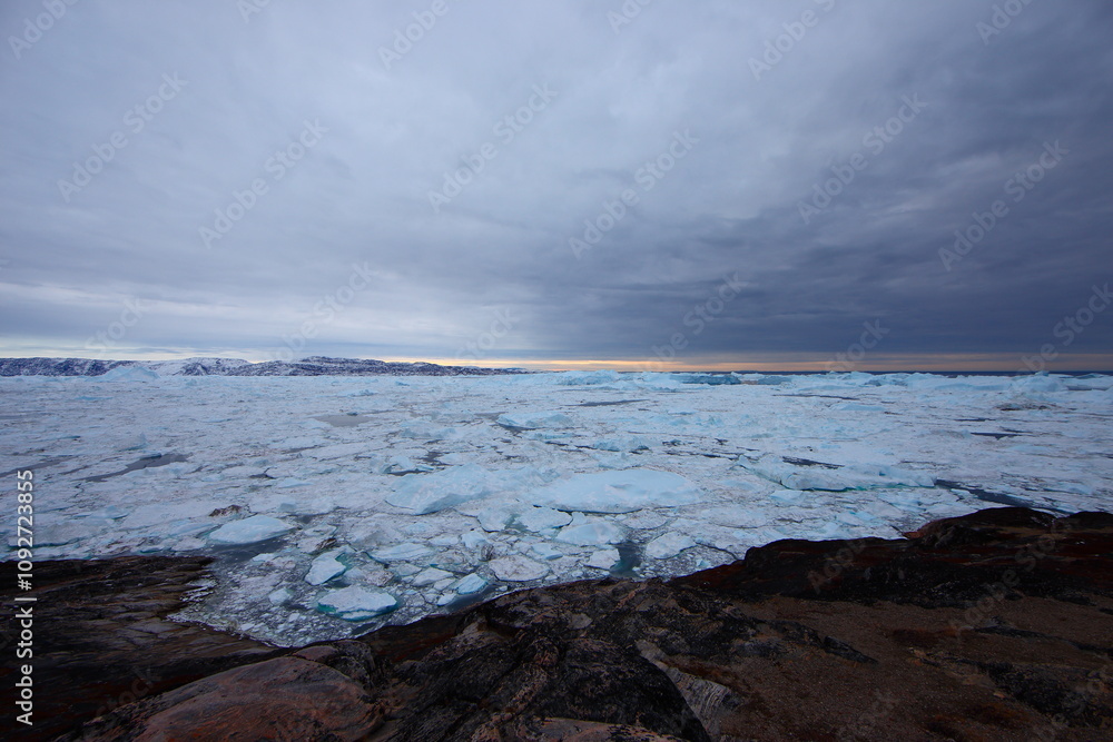 Icebergs in Ilulissat, Greenland in early winter Icebergs in Ilulissat, Greenland in early winter