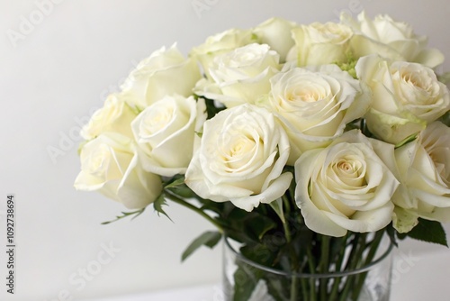 Close-up of a delicate white rose bouquet in a vase, floral arrangement, pure, indoor decor, spring flowers, elegant