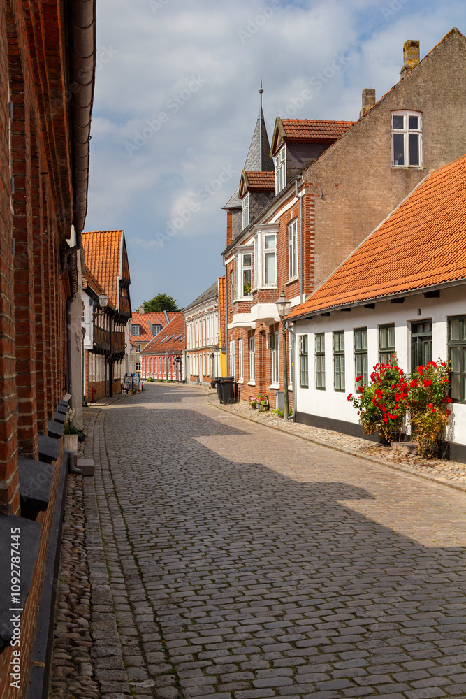 a beautiful city scape view through the small streets in the town Ribe in Denmark. With small and historic half-timbered houses in tiny alleys. a beautiful city scape view through the small streets in the town Ribe in Denmark. With small and historic half-timbered houses in tiny alleys.