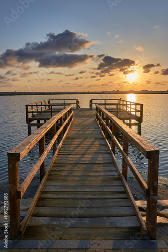 Wooden walkway of a pier at sunset in La Manga del Mar Menor. Murcia, Spain