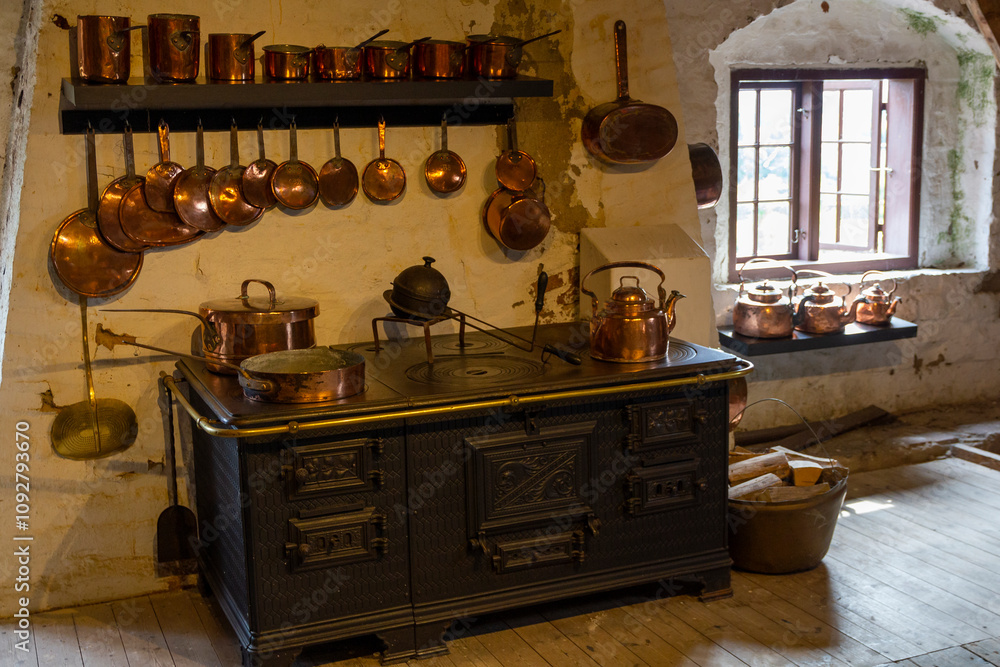an old medieval kitchen in an exhibition at Egeskov Castle in Denmark an old medieval kitchen in an exhibition at Egeskov Castle in Denmark