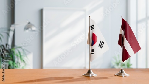 Konstfotografi FLAGS OF KOREA SOUTH AND LATVIA ON TABLE