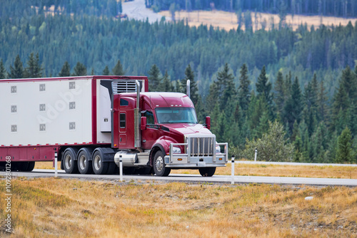 Heavy Cargo on the Road. A truck hauling freight along a highway. Taken in Alberta, Canada