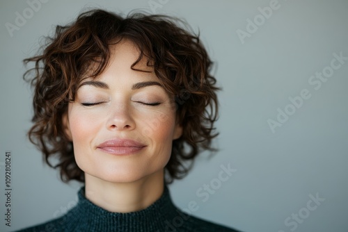 A serene woman with closed eyes, deeply immersed in a moment of solitude and tranquility, embodying peace, mindfulness, and inner balance.