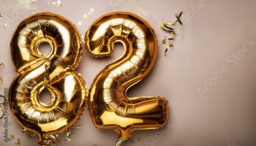  Number 82 golden balloons with copy space  photo