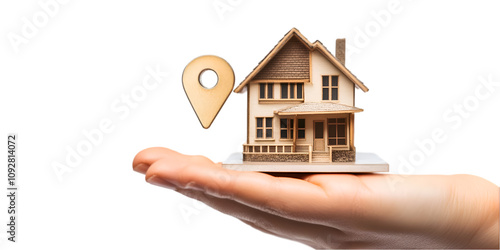 Hand Holding House Model with Red Location Marker photo