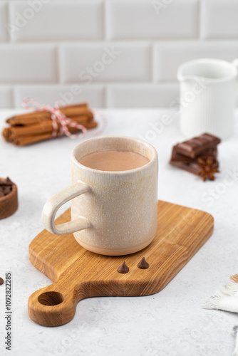 Mug of sweet hot chocolate with small bars and anise star