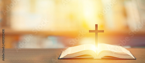 Christian wooden cross on open bible, Holy concept