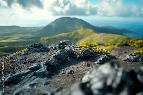 A landscape with green mountains, shot with a 21mm lens and shallow depth of field, focusing on the foreground. photo