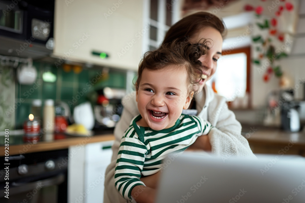 Mother holding child in front of a laptop during a virtual consultation at home with a doctor Mother holding child in front of a laptop during a virtual consultation at home with a doctor