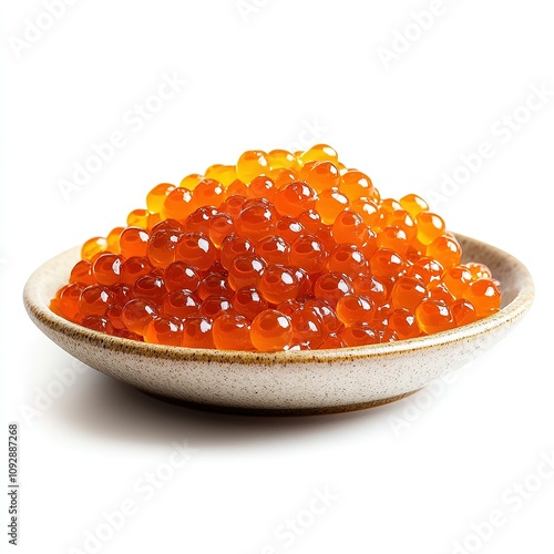 A bowl of red caviar on a neutral background.