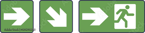 Green evacuation signs with arrows and running figure indicate emergency exit route.