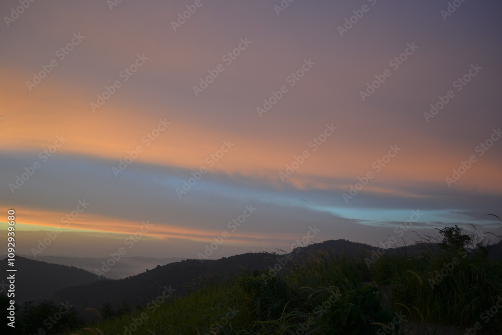 Seamless blue orange sunset sky over mountain Seamless blue orange sunset sky over mountain