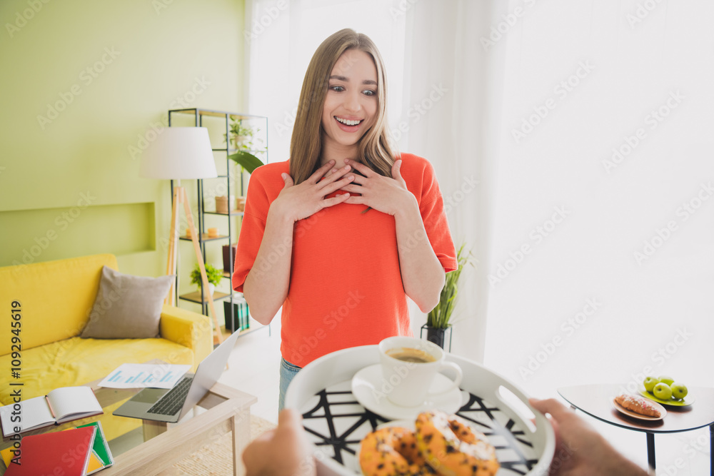 Photo of lovely young girl husband bring tray lunch dressed orange garment spacious house spring indoors room
