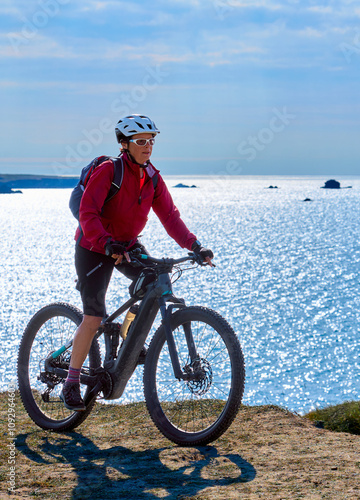 active senior woman cycling...