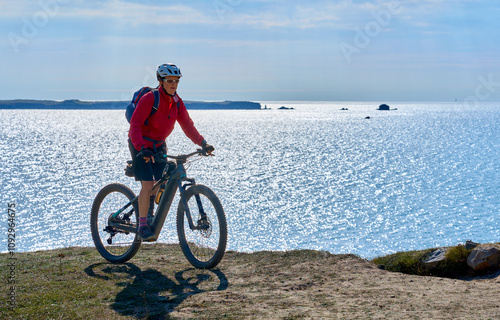 active senior woman cycling...