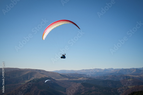 Paragliding in Ciucas mountains, Romania, during autumn season