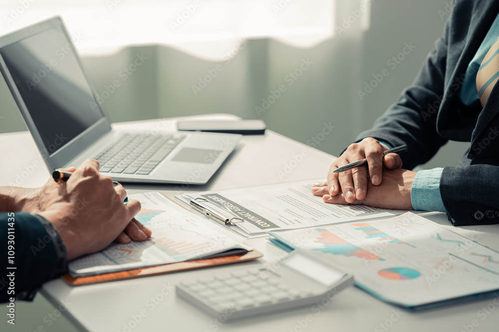 Business people discuss charts and graphs showing successful teamwork in data company growth proposal. Analytical statistics, infographics and strategy ideas Business people discuss charts and graphs showing successful teamwork in data company growth proposal. Analytical statistics, infographics and strategy ideas