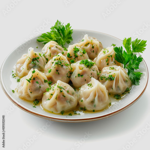 Delicious Dumplings on a White Plate Garnished with Fresh Herbs, Perfect for Traditional Cuisine Photography and Culinary Art Presentations