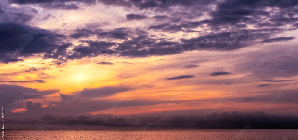 Fototapeta premium Sky Sunset in Autunm Background,Orange,Purple Sunrise with cloud over sea beach in Winter morning, Summer Dramatic majestic scenery.Seasacpe golden hour with colouful sunlight in evening