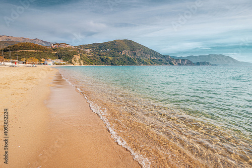 Tranquil turquoise waters lapping on the sandy shore of a picturesque beach in Montenegro