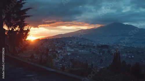 Breathtaking Sunset Over the Cityscape of Quito, Ecuador, Showcasing Vibrant Colors and Stunning Mountain Backdrop Captured in Early Evening Light