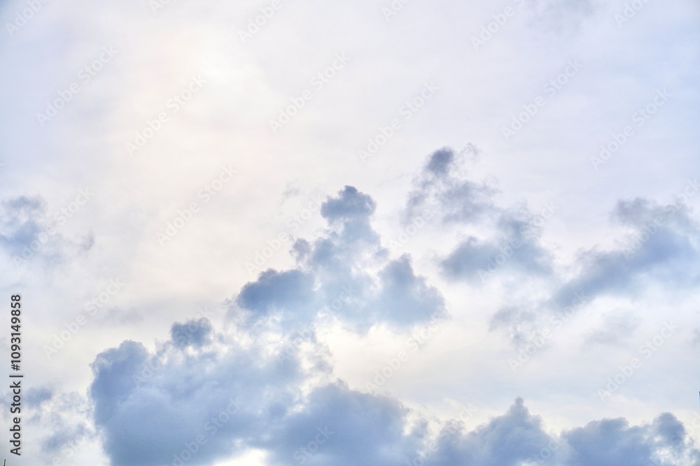 Obraz premium Bright daytime sky with fluffy gray clouds isolated on horizontal ratio outdoor environment background.