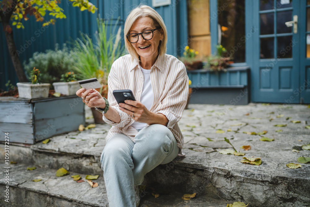 Fototapeta premium woman sit in front restaurant and shop online with credit card