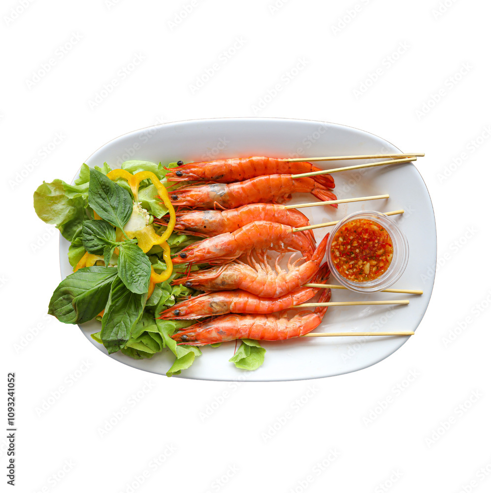 Grilled shrimp skewers served with fresh greens and a dipping sauce on a plate. Grilled shrimp skewers served with fresh greens and a dipping sauce on a plate.