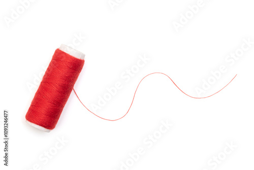 Red spool of thread isolated on white, top view