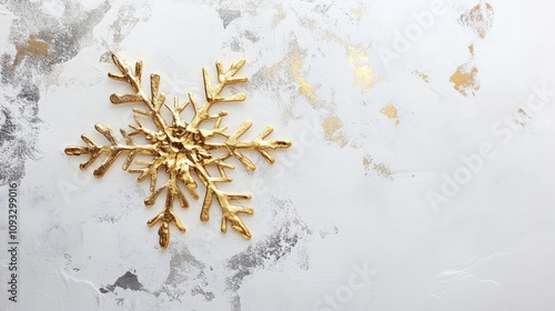 golden snowflake on white background with copyspace photo