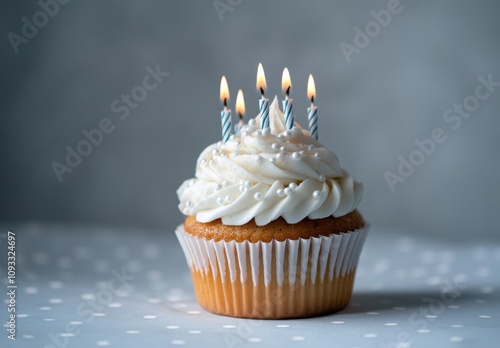 Delicious cupcake topped with creamy frosting and candles, perfect for birthday celebrations, dessert tables, and festive gatherings, inviting sweet indulgence and joy. photo