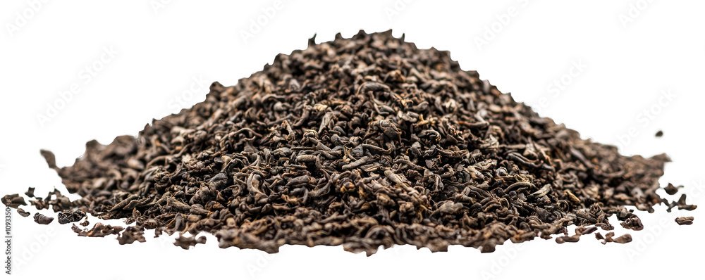 A dense pile of black tea leaves in powder form, isolated on a white backdrop. A dense pile of black tea leaves in powder form, isolated on a white backdrop.