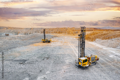 Industry Open coal mine, Drilling machine borer installing cast explosives blasting photo