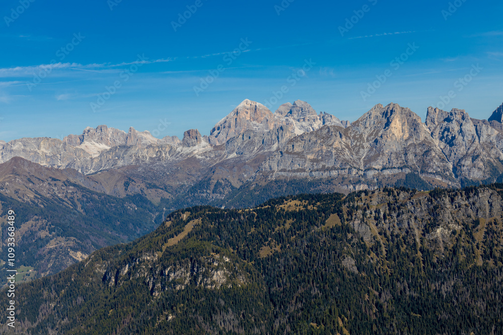 Fototapeta premium Aerial view of the Dolomites. Mountain landscape from above. Rocky peaks and mountain summits in the Alps scenic aerial view
