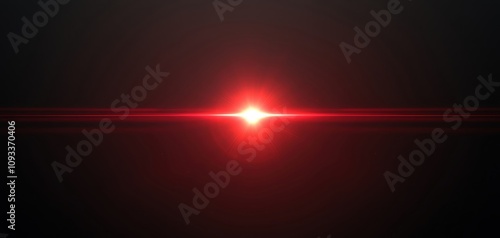 A vibrant red laser beam creating an intense focal point against a dark background.