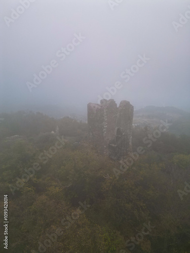 medieval fantasy tower with modern hotels in the background - aerial drone photo, serbia, vrdnik, fruska mountain photo