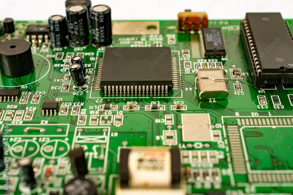 Close-up of a circuit board with microcircuits from an electrical appliance or computer. Selective focus. Close-up of a circuit board with microcircuits from an electrical appliance or computer. Selective focus.