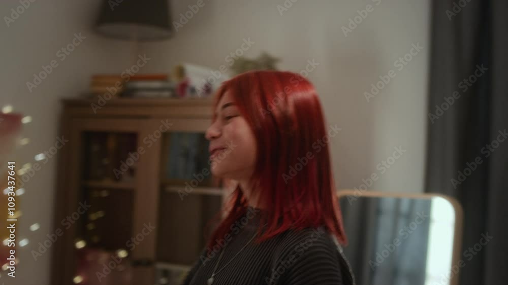 Close-up shot of two teenage girls bouncing on bed dancing to music, singing along and enjoying good time in cozy bedroom Close-up shot of two teenage girls bouncing on bed dancing to music, singing along and enjoying good time in cozy bedroom