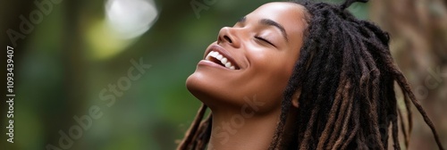 Joyful Woman with Luscious Dreadlocks Radiating Happiness - A black woman with long dreadlocks smiles radiantly outdoors, symbolizing joy, freedom, natural beauty, self-love, and inner peace.