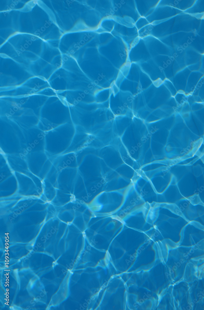 background of azure pool water with light reflections without other people or objects background of azure pool water with light reflections without other people or objects