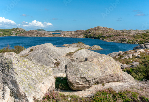 Walking path along the fjord on Skernoy island in Norway photo