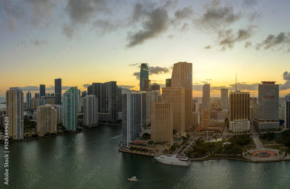 Fototapeta premium Aerial view of downtown district of of Miami Brickell in Florida, USA at sunset. High commercial and residential skyscraper buildings in modern american megapolis