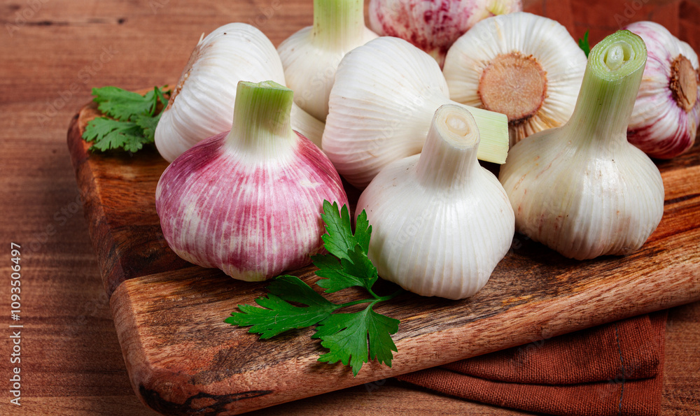Fresh young garlic, white and purple color, on a wooden table, no people, Fresh young garlic, white and purple color, on a wooden table, no people,
